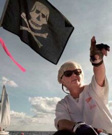 SPYC’s Helen Larsen directs her crew during a race in 1996 while flying a Jolly Roger, which she raised as a playful intimidation tactic.