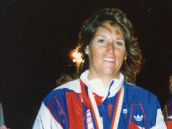 Lynne Shore with Olympic Medal
